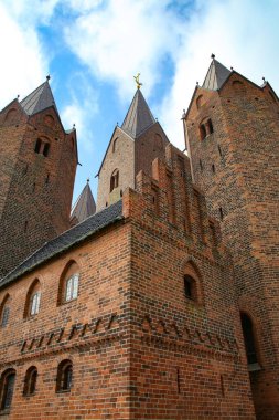 Close up of Church of Our Lady in Kalundborg, Denmark. It has five  towers, and is a landmark of the town. Red brick historic building from approximatly the early part of the 13th century. 