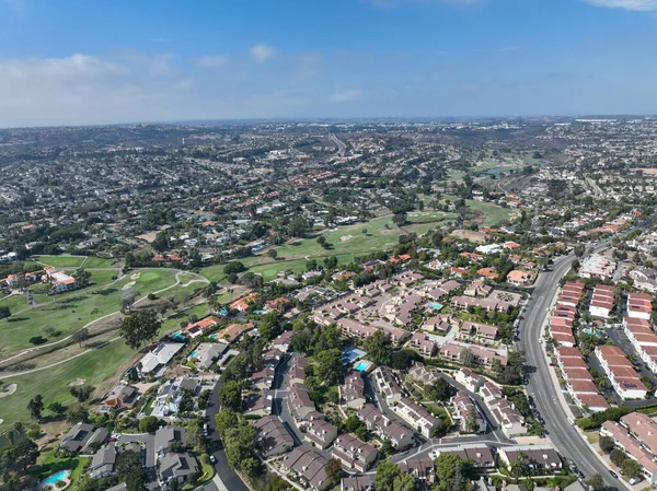 Aerial view of middle class neighborhood in Carlsbad surrounded by golf, North County San Diego, California, USA.