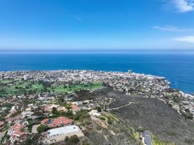 Aerial view over La Jolla Hills with big villas and ocean in the background, San Diego, California, USA