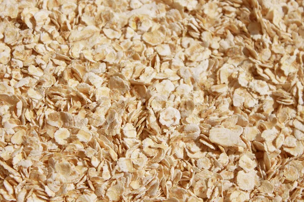 Rolled Oats Background Evenly Sprinkled Raw Thick Rolled Oats Close — Stock Photo, Image
