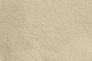 Semolina arka planı veya dokusu. Pişmemiş irilmemiş irmik un arka planı.