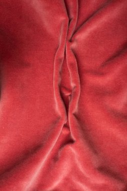 Pink soft fabric shaped as female genital organs, vulva and labia, vagina concept. High quality photo