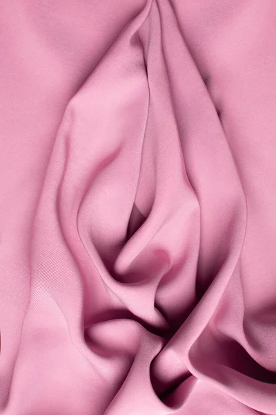 Pink soft fabric shaped as female genital organs, vulva and labia, vagina concept. High quality photo