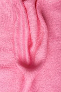 Pink soft fabric shaped as female genital organs, vulva and labia, vagina concept. High quality photo