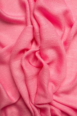 Pink soft fabric shaped as female genital organs, vulva and labia, vagina concept. High quality photo