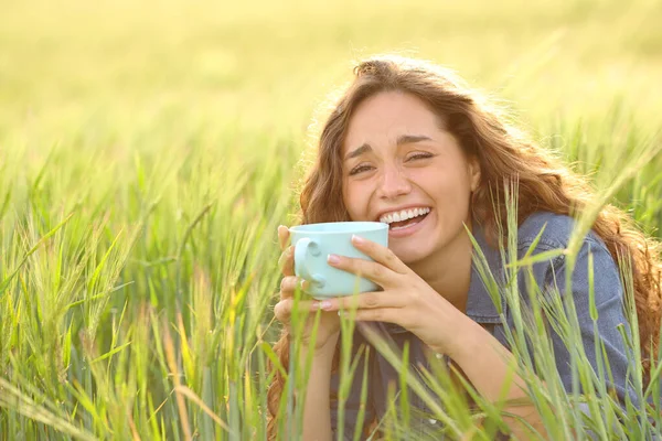 Happy Woman Laughing Drinking Coffee Field Looking Camera —  Fotos de Stock