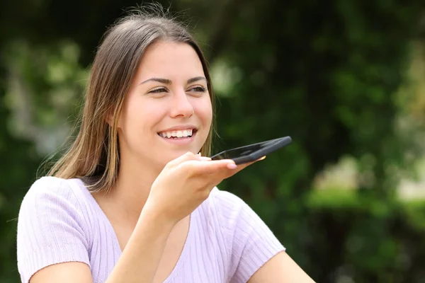 Teen Dictating Message Cell Phone Park — Stock Photo, Image