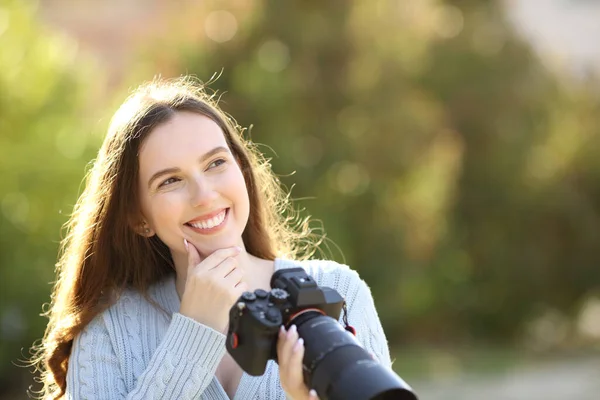 Pensive Photographer Thinking Looking Side Holding Mirrorless Camera Park — Stock Photo, Image