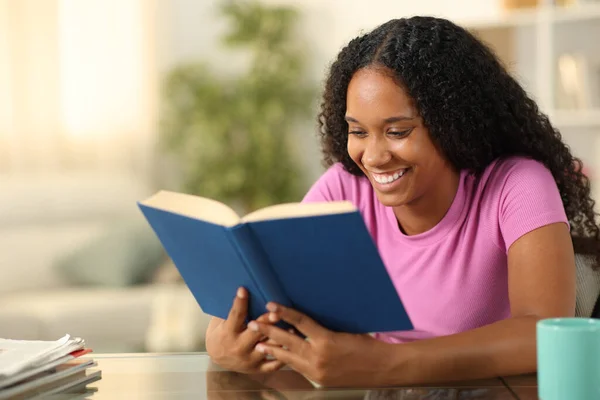 Happy Black Woman Reading Paper Book Sitting Home Royalty Free Stock Images