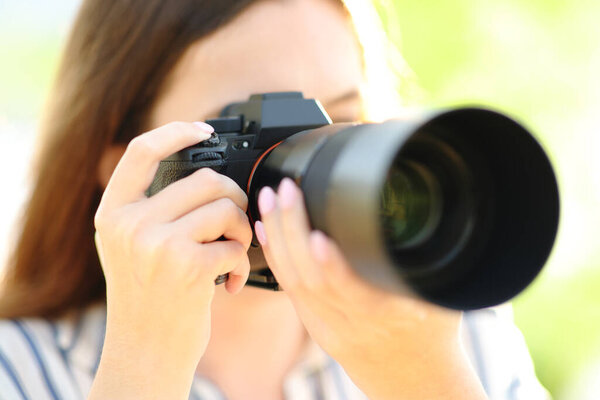 Close up of a photographer taking pictures in nature