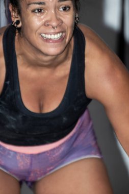 female runner resting and taking a break. Motivated sporty woman exhausted after running.