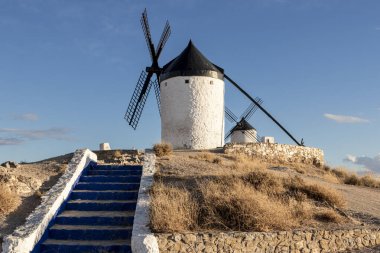 Windmills on hill at sunset in Consuegra, Mancha