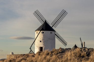 windmill on a mountain at sunset of Consuegra, Toledo province, Castilla la Mancha, Spain
