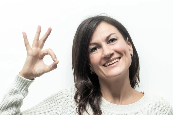 stock image Positive Communication: Woman Giving OK Sign on White Background