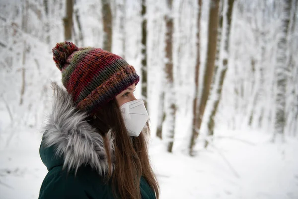 Woman White Protective Mask Stands Tranquil Snow Covered Forest She Stock Image