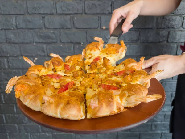 International franchise restaurant chain offers styles of pizza, stock photo