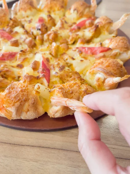 International franchise restaurant chain offers styles of pizza, stock photo