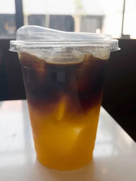 stock image A glass of iced black orange coffee, stock photo