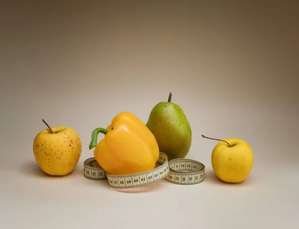 fruit and centimeter on the background. Diet