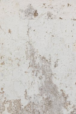 Stucco beyaz yaşlılık geçmişi. Eski kasabadaki bir duvarın parçası. Dikey