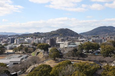 Kumamoto, Japan - January 25, 2023: Landscape of Kumamoto city from Kumamoto castle. Kumamoto is the capital city in Kyushu, Japan.