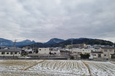 View of landscape Yufuin village in the winter after snow fall