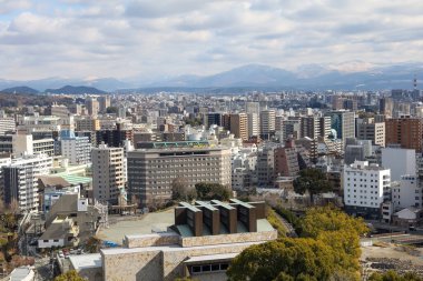 Kumamoto, Japan - January 25, 2023: Landscape of Kumamoto city from Kumamoto castle. Kumamoto is the capital city in Kyushu, Japan. clipart