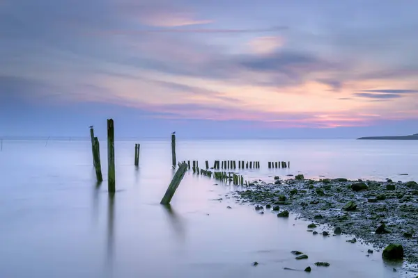 stock image Sunset view over the mudflats of the waddenzee near former harbor of De Cocksdorp, Texel, The Netherlands, named Haventje van Sil (Sil's harbor)