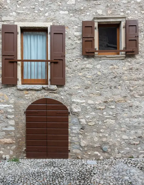 vintage door and windows on stone wall