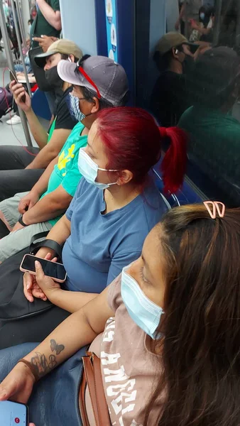 stock image Madrid, Spain - June 16, 2022: Madrid metro transport, people in medical masks