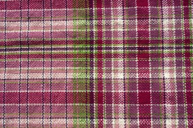    Sıcak ve yumuşak yün desenli bir elin güzel bir yakın çekimi. Doğal kırmızı kumaşın desenli dokusu. İç, arka plan, yapı.                            