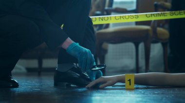 Detective Collecting Evidence in a Crime Scene. Forensic Specialists Making Expertise at Home of a Dead Person. The Concept of Homicide Investigation by Professional Police Officer.