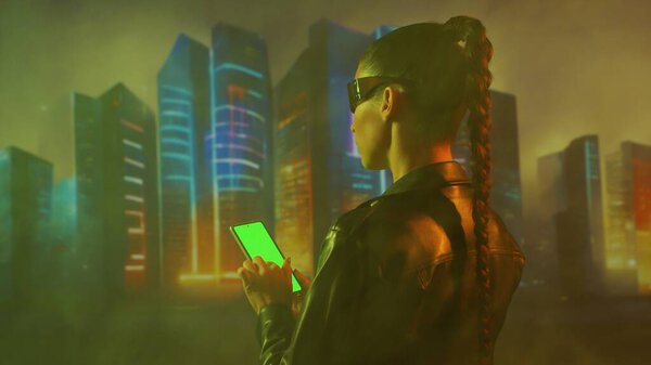 Portrait of cyberpunk girl. Beautiful young woman on the background of city scyscrapers. Futuristic concept.