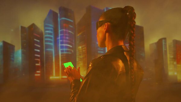 Portrait of cyberpunk girl. Beautiful young woman on the background of city scyscrapers. Futuristic concept.
