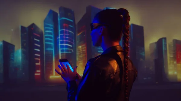 Portrait of cyberpunk girl. Beautiful young woman on the background of city scyscrapers. Futuristic concept.