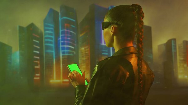 Portrait of cyberpunk girl. Beautiful young woman on the background of city scyscrapers. Futuristic concept.