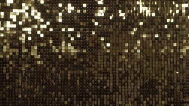 Soyut altın disko arka planı. Hareket eden ışık, yansımalar ve parıltı. Müzik, parti ve dans konsepti.