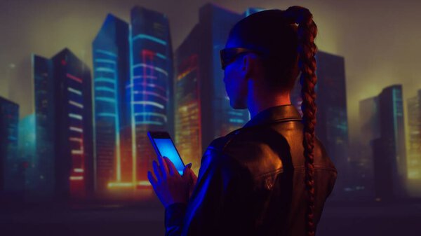 Portrait of cyberpunk girl. Beautiful young woman on the background of city scyscrapers. Futuristic concept.