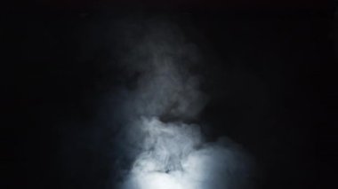 Smoke over black background. Fog or steam abstract dark texture pattern. Black background.