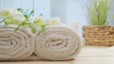 Spa background. Candles, flowers, massaging stones and herbal balls. The concept of massage, oriental therapy, wellbeing and meditation.