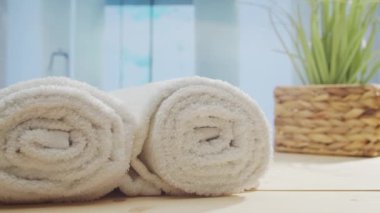 Spa background. Candles, flowers, massaging stones and herbal balls. The concept of massage, oriental therapy, wellbeing and meditation.