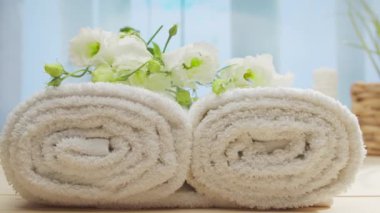 Spa background. Candles, flowers, massaging stones and herbal balls. The concept of massage, oriental therapy, wellbeing and meditation.