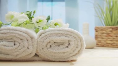 Spa background. Candles, flowers, massaging stones and herbal balls. The concept of massage, oriental therapy, wellbeing and meditation.