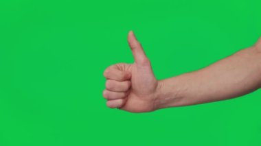 Mans hand shows gestures and signs of success on a chroma key green screen background. Thumb up. Gesture package. The concept of success, consent and approval. Template 4K.