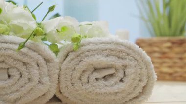 Spa background. Candles, flowers, massaging stones and herbal balls. The concept of massage, oriental therapy, wellbeing and meditation.