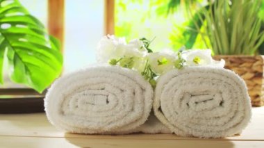 Spa background. Candles, flowers, massaging stones and herbal balls. The concept of massage, oriental therapy, wellbeing and meditation.