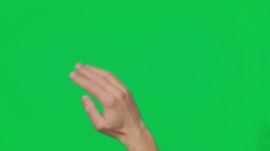 Male hand touching, clicking, tapping, sliding and swiping on chroma key green screen background. Different signs and gestures with fingers. Gestures pack. Using a smartphone, tablet or a touchscreen