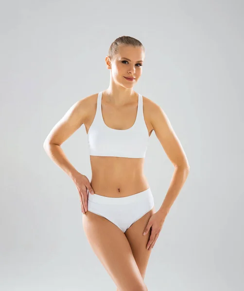 Young Fit Beautiful Blond Woman White Swimsuit Isolated Grey Background — Zdjęcie stockowe