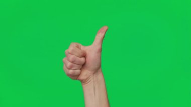 Mans hand shows gestures and signs of success on a chroma key green screen background. Thumb up. Gesture package. The concept of success, consent and approval. Template 4K.