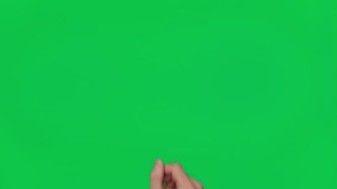 Male hand snaps his fingers on a chroma key green screen background. Fingers click. Gestures pack. Using a smartphone, tablet or a touchscreen. Interface concept. 4K template.